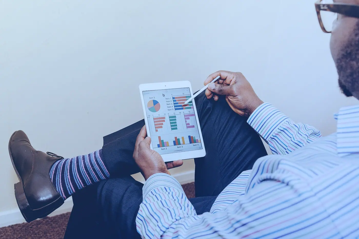 Someone using a tablet in a meeting